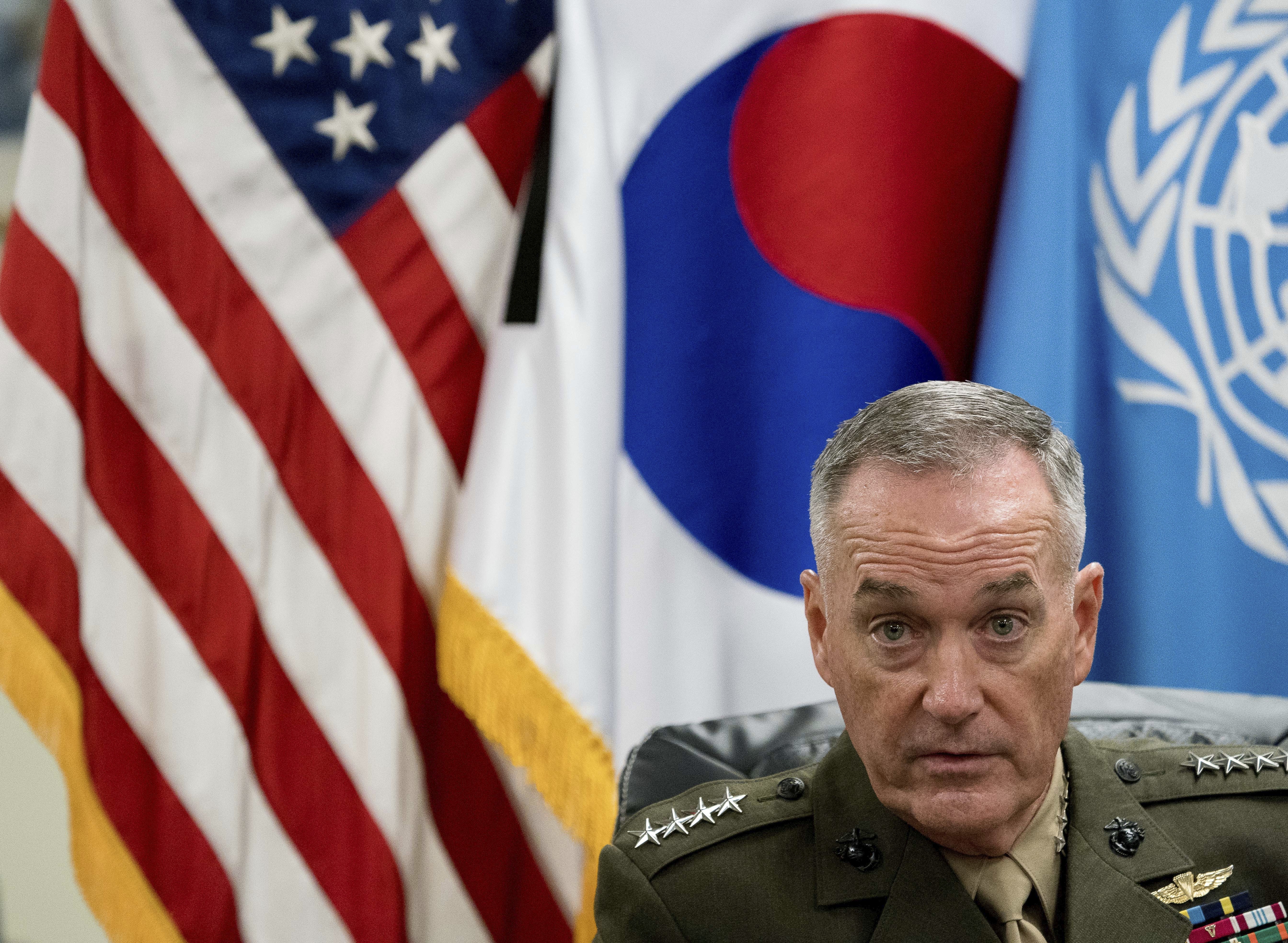 Korea tensions ease slightly as U.S. officials play down war risks