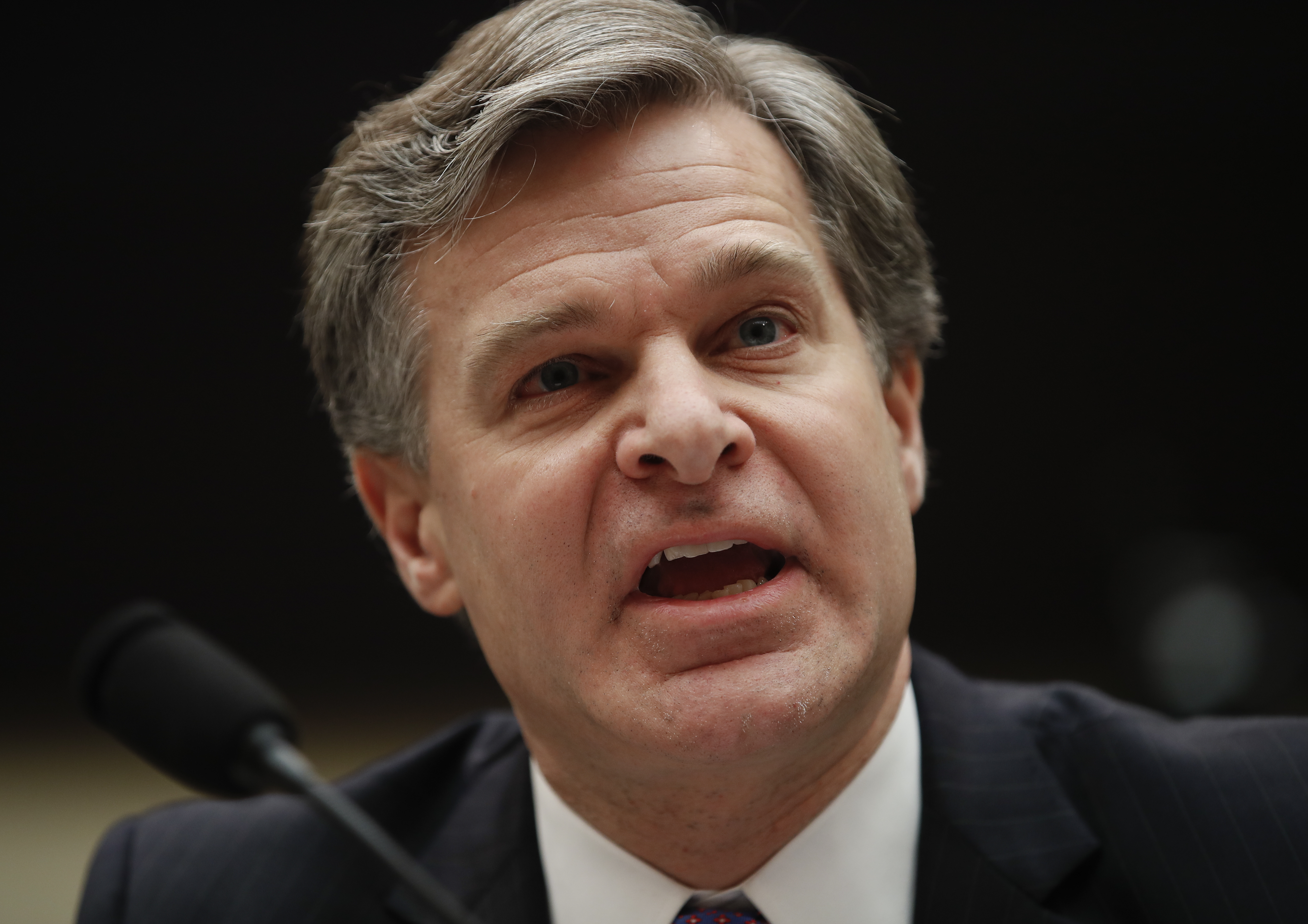 FBI director defends his agency against Trump's attacks