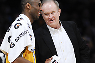 Bill chats with Kobe Bryant of the Los Angeles Lakers during a break at a game.

Courtesy AP/Wide World Photos.