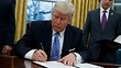 Trump freezes hiring of many federal workers
